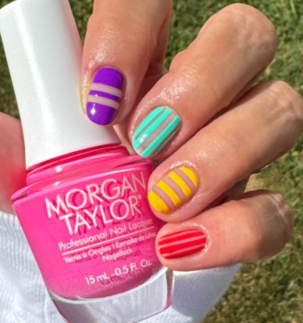 Clean negative-space design, beach towel nails - Morgan Taylor Summer 2925 on short natural nails in daylight.